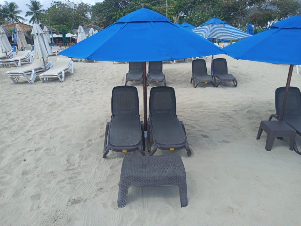 Playa Dorada - 2 Beach Lounge Chair and an umbrella rentals